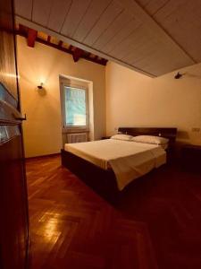 a bedroom with a bed and a window at Matteotti28 in Pesaro
