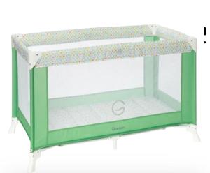 a crib with a green and white canopy with a crib at Alloggio Ziu Oreddu in Orgosolo