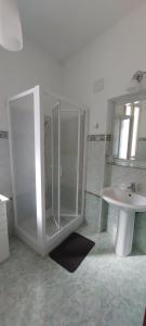 a bathroom with a shower and a sink at Alloggio Ziu Oreddu in Orgosolo