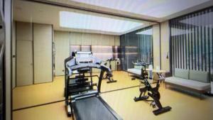 a gym with two treadying machines in a room at JI Hotel Beijing Huilongguan in Changping