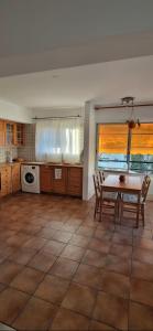 a kitchen with a table and chairs in a room at Spacious Central Nicosia Flat - Quiet & SafeArea in Nicosia