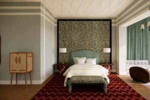 a bedroom with a large bed and a red rug at Hotel Club 29 in Barcelona