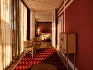 a room with a table and chairs and a bedroom at Hotel Club 29 in Barcelona +20 photos