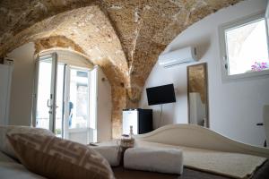 a living room with a large stone ceiling at Ercole B&B in Ugento
