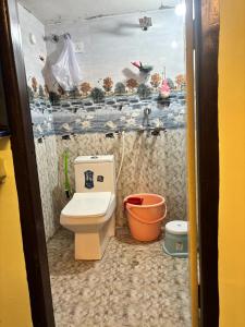 a small bathroom with a toilet and a sink at Lara Homestay 1bhk Begumpet in Hyderabad