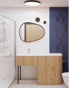 a bathroom with a sink and a mirror at Cobalt36 in Bolesławiec
