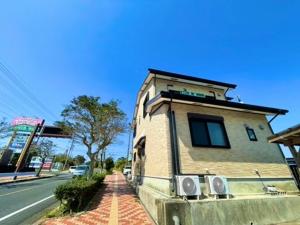 a small building on the side of a street at あざみ庵 屋久島 in Yakushima