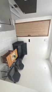 a room with two chairs and a table in a room at Hotel Venezia Grand in Gurgaon +2 photos