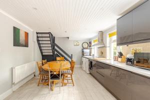 a kitchen with a table and chairs in a kitchen at Explore the west in Loughrea