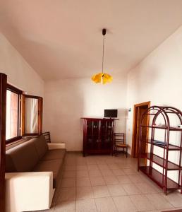 a living room with a couch and a table at Villetta Rose in Rena Majore