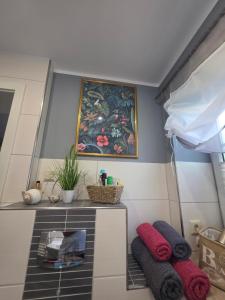 a room with two pillows and a painting on the wall at Kleine Auszeit in Stolpe auf Usedom +22 photos