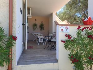 a house with a hallway leading to a patio at casa oleandri in Golfo Aranci