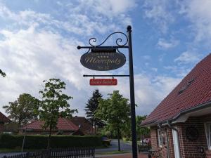 a sign for a marvellous mcdonalds restaurant at Ferienhaus Moorspatz, 95143 in Rhauderfehn +21 photos
