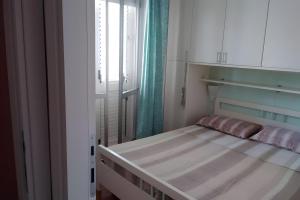 a small bedroom with a bed and a window at Casa al Mare Ingresso Indipendente in Casalbordino