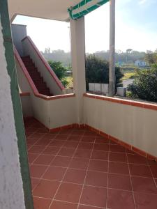 a balcony with two stairs and two windows at Casa al Mare Ingresso Indipendente in Casalbordino +3 photos