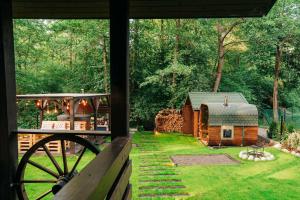 a view of a barn from the window of a cabin at Magiczne Roztocze in Koszele