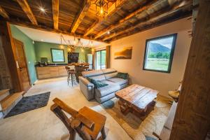 a living room with a couch and a table at Châlet Haut de Gamme Pyrenees in Guchan