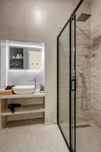a bathroom with a sink and a shower at Garden Residence in Ermoupoli +28 photos