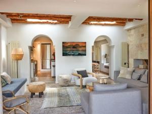 a living room with couches and chairs at Kasbah 2 in Sant Josep de sa Talaia