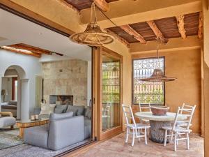 a living room with a table and chairs at Kasbah 2 in Sant Josep de sa Talaia