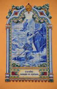 a painting of a woman on a wall at Sea Garden Peniche in Peniche