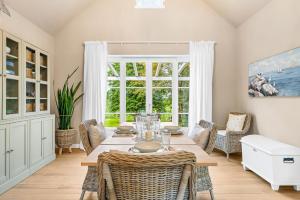 a dining room with a table and chairs at Wild Wilderness in Schaalby