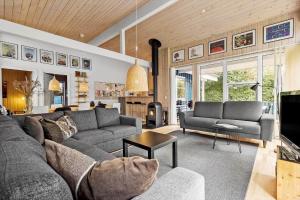 a living room with a couch and a table at 8522-Grenaa-Nobilisvej-15 in Grenå