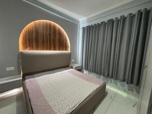 a bed in a room with at Potion's Villa - Shimla in Shimla