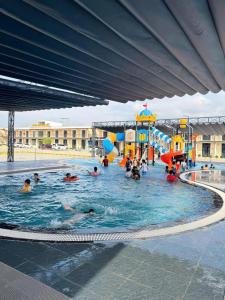 a group of people in a pool at a water park at Minh Hai Hotel Lao Bao in Lao Bao