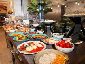 a buffet line with many plates of food at ART Hotel in Sibiu