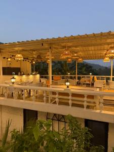 a building with a deck with lights on it at ART Sattal in Bhīm Tāl