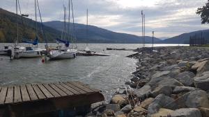 a group of boats docked on a body of water at Noclegi Onesto in Międzybrodzie Bialskie +3 photos
