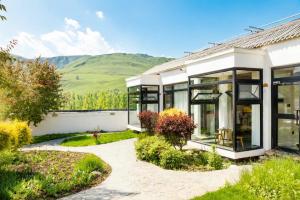 a house with a view of the mountains at Houshan Park House in Narat