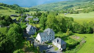an aerial view of a large house in a field at L'Estive du Claux in Le Claux