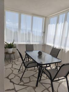 a dining room with a table and chairs in a room at Apartment Elena in Sumartin +40 photos