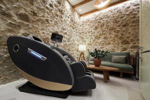a living room with a whale reclining chair at Diastar Boutique in Heraklio
