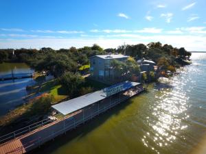 an aerial view of a dock next to the water at Painted Sky Inn in Burnet