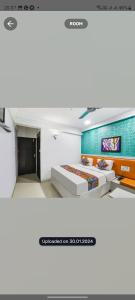 a bedroom with two beds in a room at Hotel Sonali Regency in Bhopal