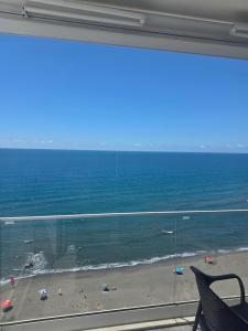 a view of the beach from a window at Amfora apartament Studio in Lezhë
