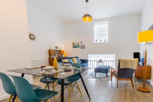 a dining room and living room with a table and chairs at 1 Bed in Cromer oc-1844 in Cromer