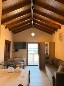 a living room with a couch and a table at Limanaki 1 in Chios