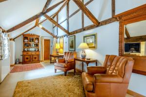 a living room with leather chairs and a table at 5 Bed in Magham Down oc-sx942 in Hailsham
