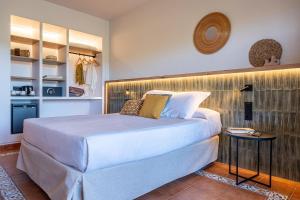a bedroom with a large white bed in a room at Estival Park Marena in La Pineda +62 photos