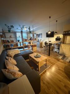 a living room with a couch and a table at Apartman BibKa in Donovaly