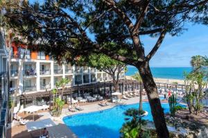 a view of the hotel and beach from the balcony of a hotel at Estival Centurión Playa in Cambrils