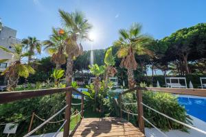 a view from the balcony of a resort with palm trees at Estival Isla Cristina in Isla Cristina