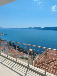 a balcony with a view of the water at Oikonomou Villas 2 in Ermioni