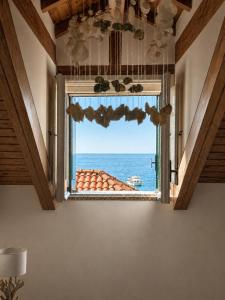 a window in a room with a view of the ocean at Luna Rossa in Minori