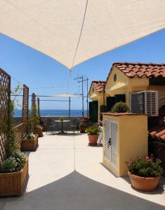 a patio with a view of the ocean from a house at Luna Rossa in Minori