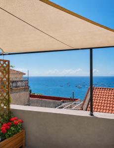 a view of the ocean from a balcony at Luna Rossa in Minori
